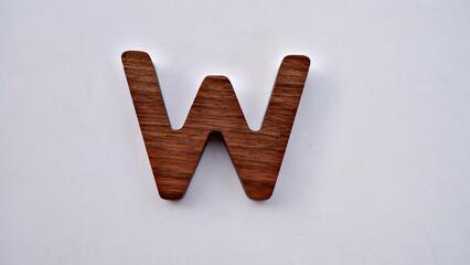 Wooden textured alphabet letters on a white background , selected focus isolated photo