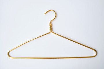 White clothes hanger on a light background. Smart consumption or sales concept