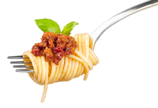Spaghetti on fork with tomato sauce and parsley