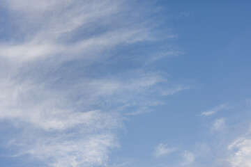 Blue Summer Sky Background with light cumulous clouds