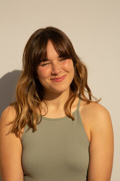 Woman squinting in the sun
