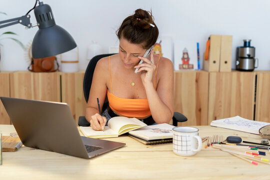 Illustrator woman calling by phone at office 