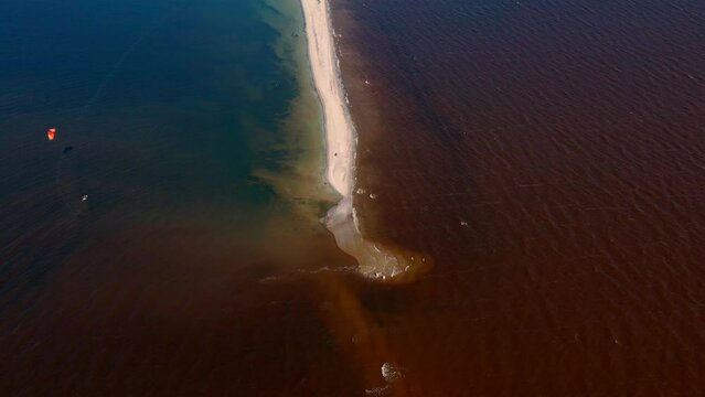 top view of an amazing natural phenomenon, the junction of the waters of two different rivers of different colors, blue and red. aerial view beauty of nature in Ukraine