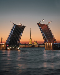 Fototapeta na wymiar Raised bridge in the evening in the center of St. Petersburg