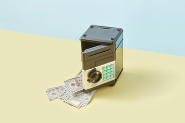 Safe-deposit box with dollars falling out.