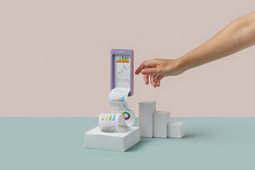 Mobile phone mock-up with paper charts and hand.