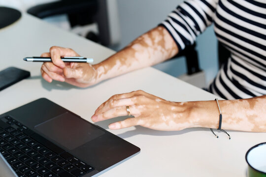 Anonymous Business Woman At Laptop.