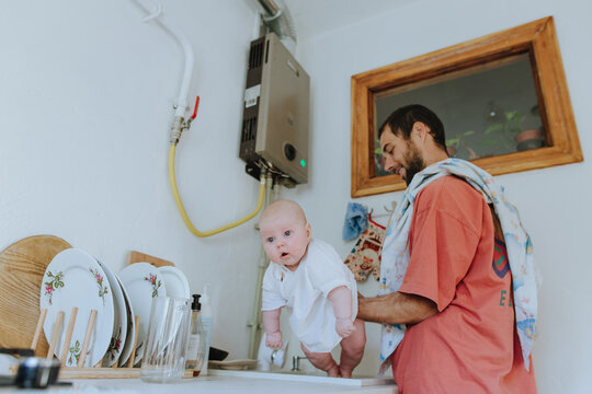 father holding little daughter