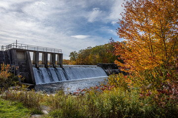 Shohola Falls Dam in the Poconos, PA, is surrounded by beautiful fall foliage 