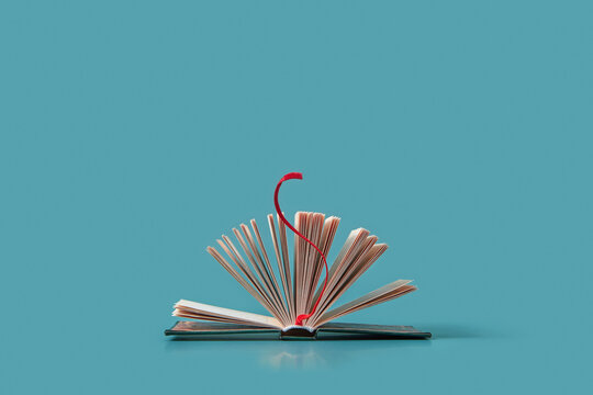 Open book with red bookmark.