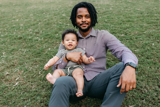 A father holding his 7 month old son
