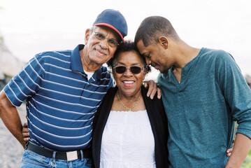 A mother with her husband and adult son
