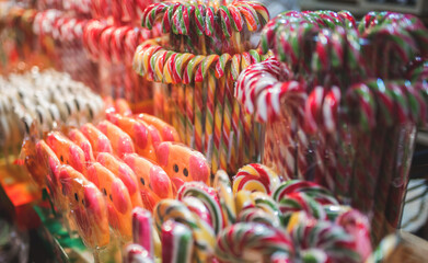 Christmas colored candy canes and others are on the counter