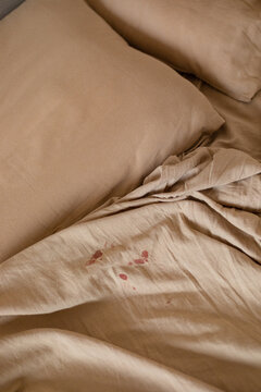 blood on bed sheet during period

