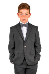 Adorable young man dressed up in a suit and tie