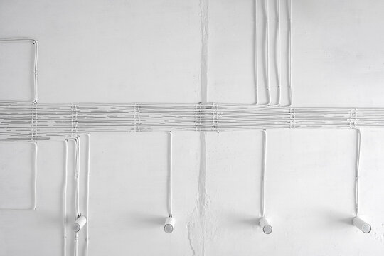 Electric wire painting white colour on wall