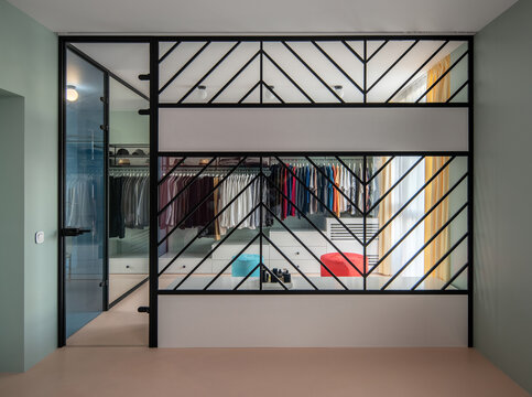 Huge modern wardrobe with different clothes for dressing room