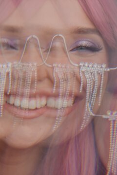 Emotional happy surreal portrait of model with pink hair