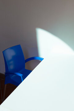 Blue chair with a light apparition