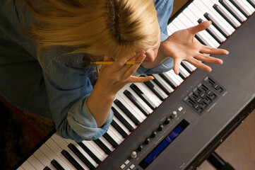 Frustrated Musician Performs on an Electric Piano Keyboard