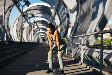 Exhausted runner woman resting