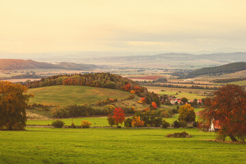 Fototapeta na wymiar Hilly rural landscape in autumn season.