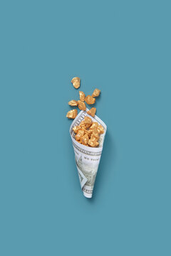 Gold nuggets packed in one hundred dollar bill.