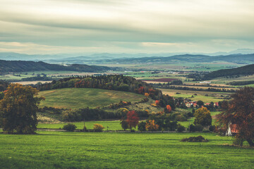 Fototapeta na wymiar Hilly rural landscape in autumn season.