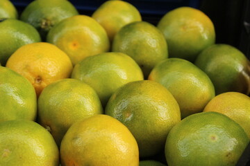 Colored fruits and vegetables at a grocery store. New season foods