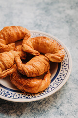 vintage plate with medialunas, argentinian sweet croissant.