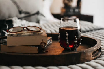 Cozy bedroom reading on halloween.