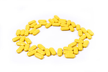 Medical orange pills on isolated on white background
