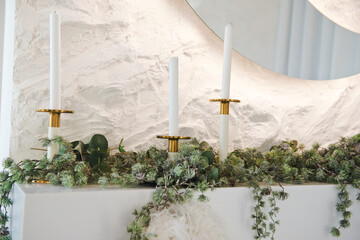 New Year's decorations. New Year's decorations. Fireplace with candlesticks. Luxury living room with a Christmas decor. Holiday background.