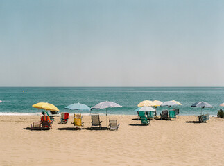 Umbrellas and beach chairs