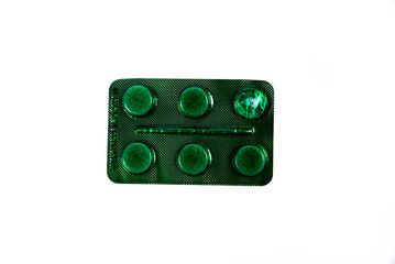 Сapsule pills in blister on a white background