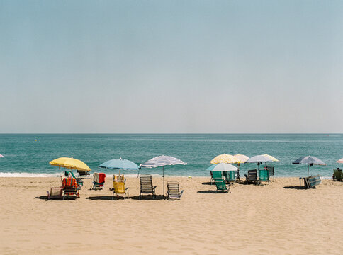 Fototapeta Umbrellas and beach chairs