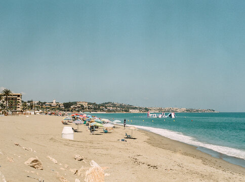 Fototapeta Umbrellas and beach chairs