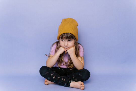 Stylish little toddler looking bored