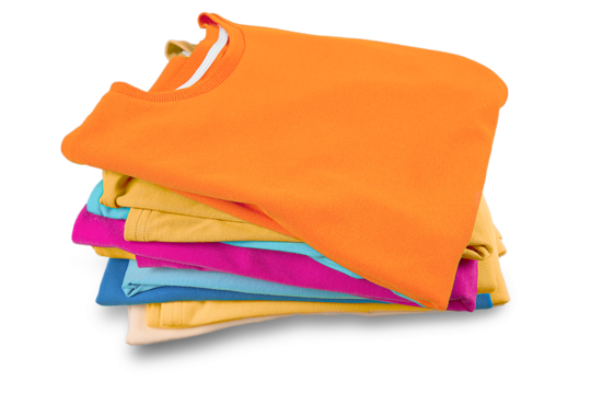 Stack of folded garments. Closeup over white background.