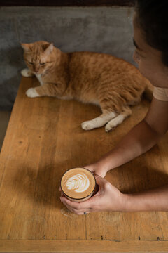 Asian woman drinking latte 