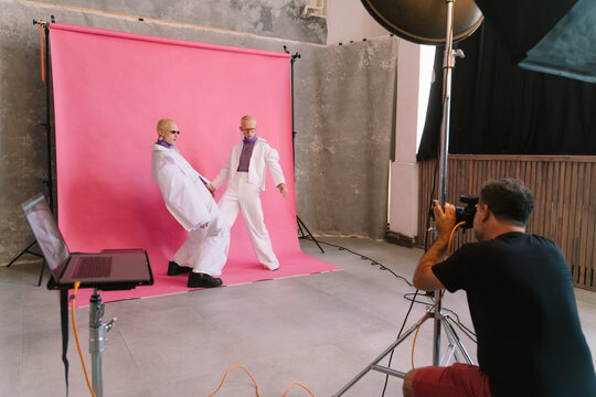 Models Posing For Photographer