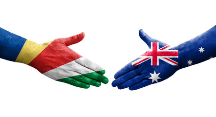 Handshake between Australia and Seychelles flags painted on hands, isolated transparent image.