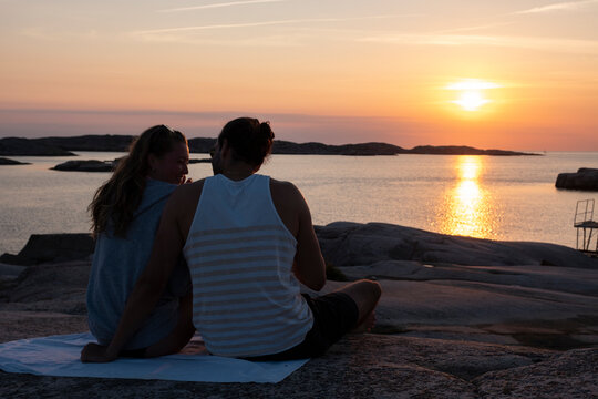 loving couple Enjoying Sun At Sunset Time