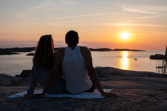 loving couple Enjoying Sun At Sunset Time