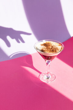 Coffee cocktail on purple background