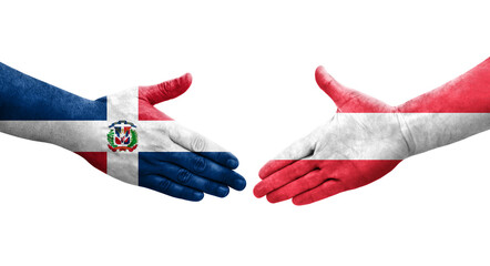 Handshake between Austria and Dominican Republic flags painted on hands, isolated transparent image.