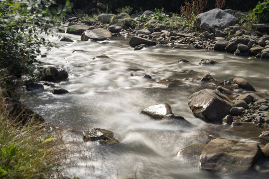 Closeup view at mountain river with rock bottom