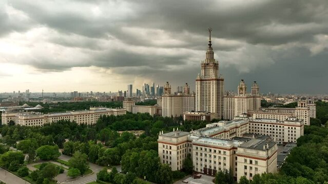 The main building of Moscow State University against the background of a cloudy stormy sky. The famous Stalin high-rise, a monument of Soviet architecture against the background of the modern city.