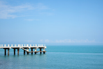 Fototapeta premium Beautiful white pier in sea on sunny day, space for text