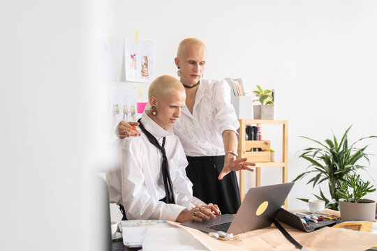 People Using Computer And Talking